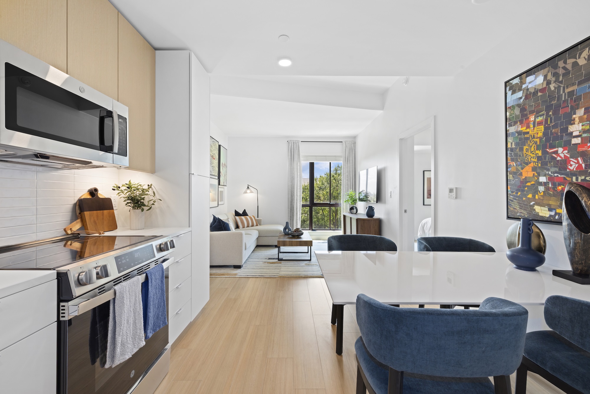 open living concept showing living room and kitchen combined with ample space for seating and modern living room decor open living concept showing living room and kitchen combined with ample space for seating and modern living room decor
