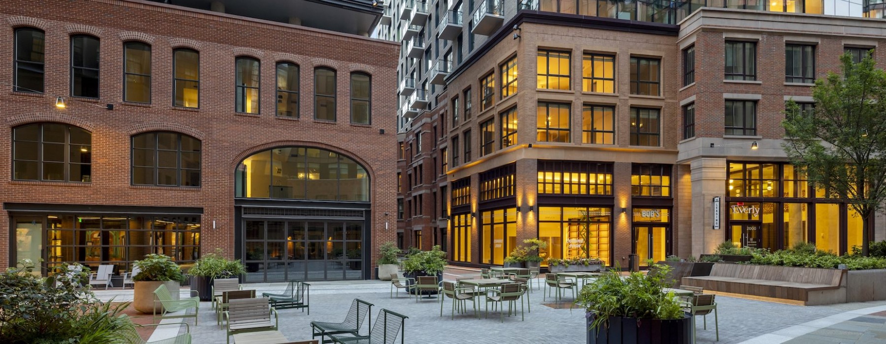 Exterior courtyard in corso with seating and view of Everly and Byron 