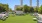 rooftop green recreational area with seating and tables