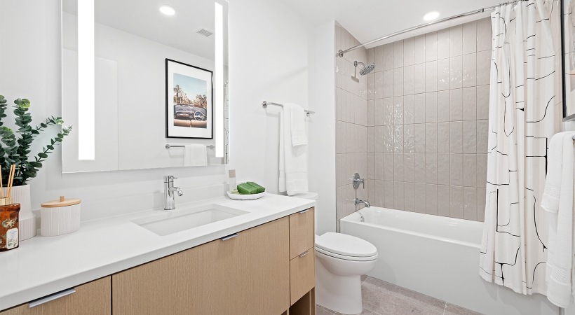 bathroom with sink mirror toilet and shower