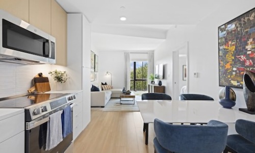 Kitchen and dining seating Kitchen with tile backsplash, stainless steel appliances, and under cabinet lighting