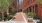 a brick walkway between buildings