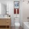 bathroom with sink mirror shower and toilet 