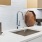 kitchen sink with trinkets and white countertop