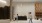 a lobby with a reception desk people and seating 