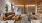 a room with seating tables and fireplace