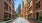 a brick walkway between buildings