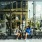 a couple sitting outside a cafe