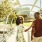 A woman and man walking along the Riverwalk Trail